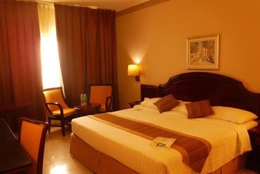 L'une des chambres de l'htel Muscat Holiday