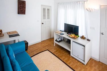 Le salon de la family garden room, cosy et familial pour des moments entre famille