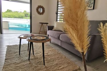 Le salon de l'appartement Malanga est cosy uax inspirations tropicales